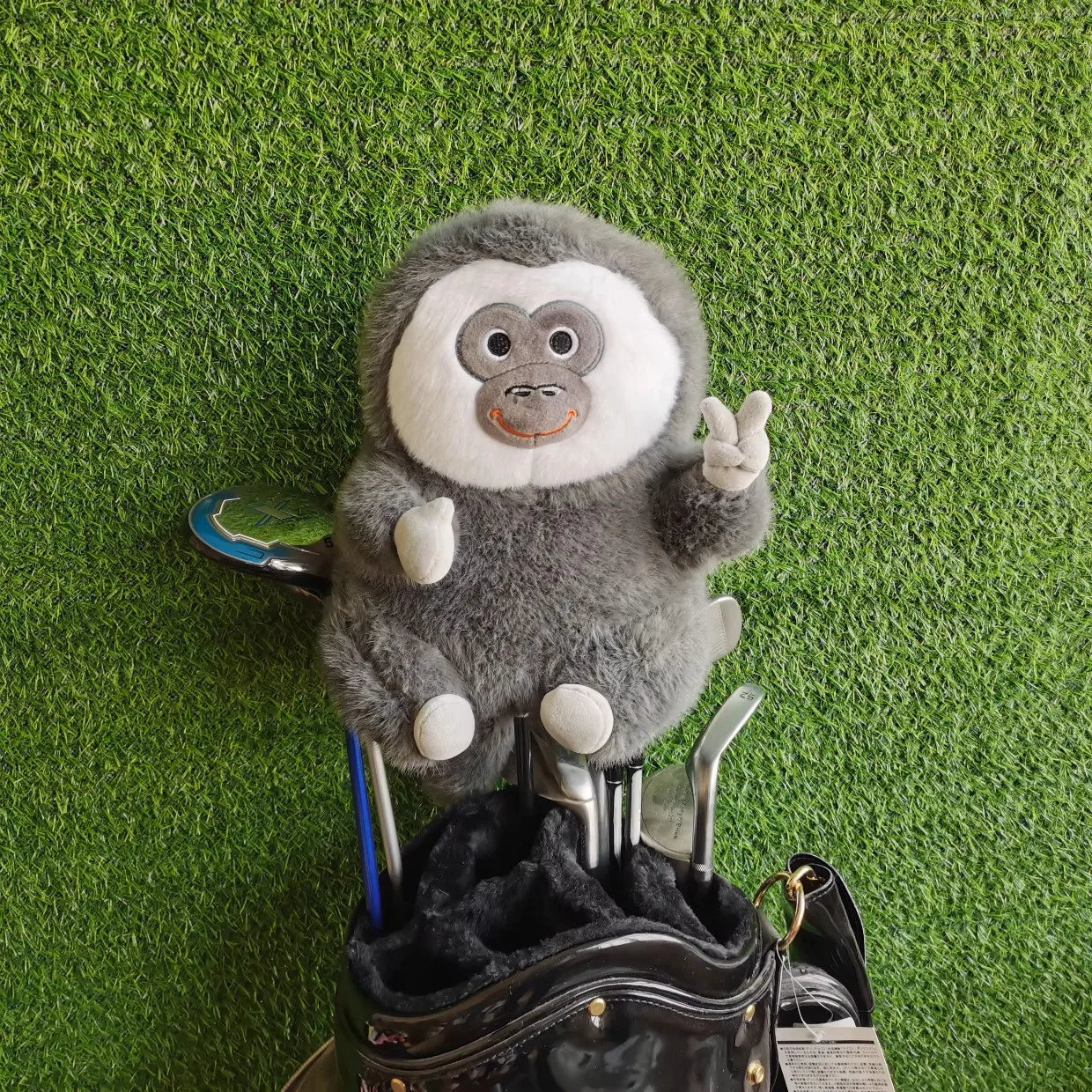 Smiling fuzzy monkey driver head cover with peace sign – plush golf club protector